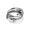 Gellner-stål-armbøyle-med spinell,hematitt og Tahitiperler 8 – 9,5 mm