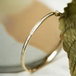 Pan Jewelry – Armring i gult gull med zirkonia